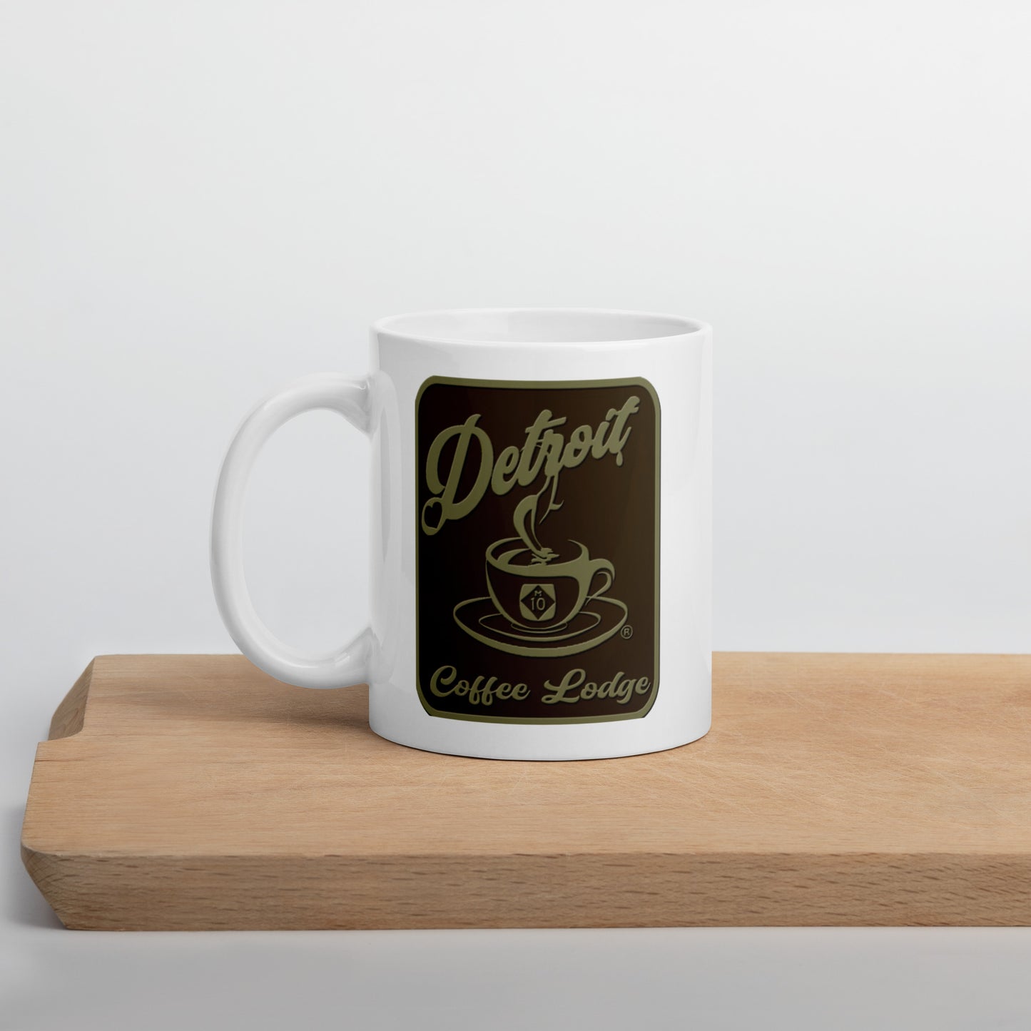 White glossy mug with brown logo